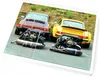 Two Porsche 911 engines are displayed in front of their respective cars, a brown and a yellow one. Náhled obrázku produktu