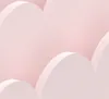 A close-up view of a pink and white cloud-shaped shelf. Náhľad obrázku produktu