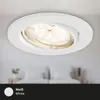 A white LED recessed spotlight is shown installed on a white ceiling, with a blurred background of a bedroom. A black bar at the bottom displays a white circle and the text 'Weiß White'. Produktbild-Vorschau