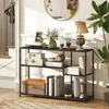 A console table with various decorative items and books placed on its shelves, set in a well-lit hallway with a staircase visible in the background. Podgląd zdjęcia produktu