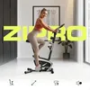 A woman is exercising on a stationary bike in a modern, well-lit room. The brand name 'ZIPRO' is prominently displayed in large yellow letters across the image. Produktbild-Vorschau