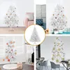 A collage of images showing white Christmas trees decorated with various ornaments and placed in different settings. Podgląd zdjęcia produktu
