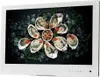 A flat lay of oysters on ice, with a small bowl of beans in the center, displayed on a screen. Produktbild-Vorschau