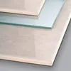 A close-up shot of ceramic tiles and a glass pane, likely showcasing materials or a product related to them. Podgląd zdjęcia produktu