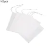 A stack of white, square filter bags with drawstrings, on a white background. Produktbild-Vorschau