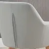 Close-up of the back of a gray upholstered chair with wooden legs. Podgląd zdjęcia produktu