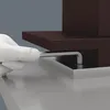 A white gloved hand uses a hex key to tighten a screw on a brown object with a silver base. Produktbild-Vorschau