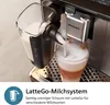 A close-up shot of a Philips coffee machine frothing milk into a glass. Produktbild-Vorschau