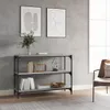 A modern living room with a bookshelf, artwork, and a chair. Podgląd zdjęcia produktu