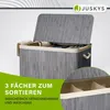 A close-up view of a grey bamboo laundry basket with its lid open, showing the interior compartments and some folded laundry. Náhľad obrázku produktu