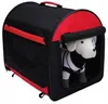 A dog carrier with a stuffed dog inside. Produktbild-Vorschau