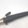 A close-up shot of the handle and controls of a curling iron. Produktbild-Vorschau