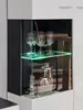 Close-up of a modern display cabinet with glassware and decorative items. Produktbild-Vorschau