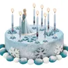A Frozen-themed birthday cake with candles and snowflake decorations. Anteprima dell’immagine prodotto
