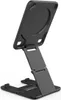 A black, foldable phone stand is shown against a white background. Produktbild-Vorschau