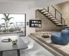 A modern living room with a TV mounted on the wall, a staircase, and furniture. Produktbild-Vorschau