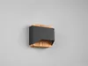 A modern wall lamp with a black metal shade and a wooden base, mounted on a gray wall. Podgląd zdjęcia produktu