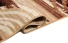 A close-up of a rolled-up rug with a beige and brown abstract pattern. Produktbild-Vorschau