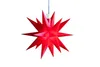 A red star-shaped decoration hangs against a white background. Produktbild-Vorschau