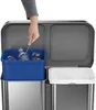A person's hand is using tongs to place a plastic bottle into a blue bin inside a dual-compartment trash can. Podgląd zdjęcia produktu