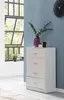 A white chest of drawers with a purple vase and greenery on top, placed next to a large window with a view of trees. Voir les images du produit