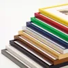 A stack of colorful picture frames arranged diagonally against a white background. Produktbild-Vorschau