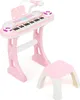 A pink toy keyboard with a microphone, stand, and stool on a white background. Produktbild-Vorschau