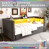 A bedroom scene featuring a sofa bed with integrated LED lighting and shelving. Náhled obrázku produktu
