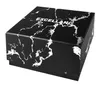 A black box with a white marble pattern and the word EXCELLANC printed on it. Produktbild-Vorschau