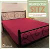 A bed with a fitted sheet in a bedroom setting. Produktbild-Vorschau