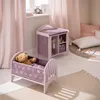A child's bedroom with a doll's cradle and changing table. Produktbild-Vorschau