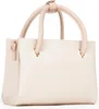 A cream-colored handbag with beige handles is shown against a white background. Podgląd zdjęcia produktu