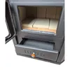 Close-up view of a black wood-burning stove with its ash drawer partially open. Produktbild-Vorschau