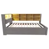 A product shot of a bed frame with a headboard featuring shelves and integrated lighting. Voir les images du produit
