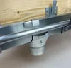 A close-up view of a gutter system component attached to a wooden beam. Produktbild-Vorschau