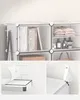 Close-up of a modular storage unit, showing shelves filled with books, toiletries, and folded clothes, with detailed insets of assembly components and door hinges. Produktbild-Vorschau