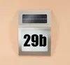 A solar-powered house number light with the number '29b' displayed. Produktbild-Vorschau