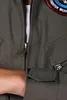 Close-up of a pilot jumpsuit with a patch on the chest. Produktbild-Vorschau