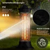 A black outdoor heater is shown in a garden setting with water spraying on it. Produktbild-Vorschau