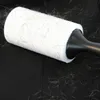 A lint roller covered in pet hair is shown on a black surface, likely a piece of furniture. Anteprima dell’immagine prodotto