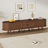 A modern living room with a TV stand, artwork, and decorative items. Podgląd zdjęcia produktu