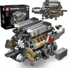 A detailed model of a W16 engine, likely a building block set, is displayed prominently with its packaging in the background. Voir les images du produit
