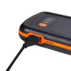 A close-up shot of a black and orange power bank with a USB cable plugged into it. Náhled obrázku produktu