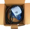 A timing belt kit is shown inside a cardboard box. Podgląd zdjęcia produktu