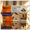 Kandylas Halva mit Pistazien 200 g Verpackung im eleganten Setting mit Pistazien Produktbild-Vorschau