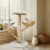 Three cats are interacting with a multi-level cat tree in a well-lit room with a window and furniture. Produktbild-Vorschau