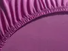 A close-up view of a purple fitted sheet, showing the elasticized edge and the texture of the fabric. Produktbild-Vorschau