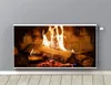 A radiator cover with a fireplace image is mounted on a gray wall above a wooden floor. Produktbild-Vorschau