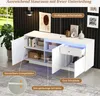 A white sideboard with open doors and a drawer, showcasing its interior storage and adjustable shelves, with LED lighting visible. Anteprima dell’immagine prodotto