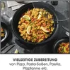 A paella dish is shown in a large black electric pan, with a glass lid slightly ajar. The pan is placed on a dark, textured surface, possibly a countertop or table. There are also two small black plates with portions of the paella, and cutlery to the left. Anteprima dell’immagine prodotto